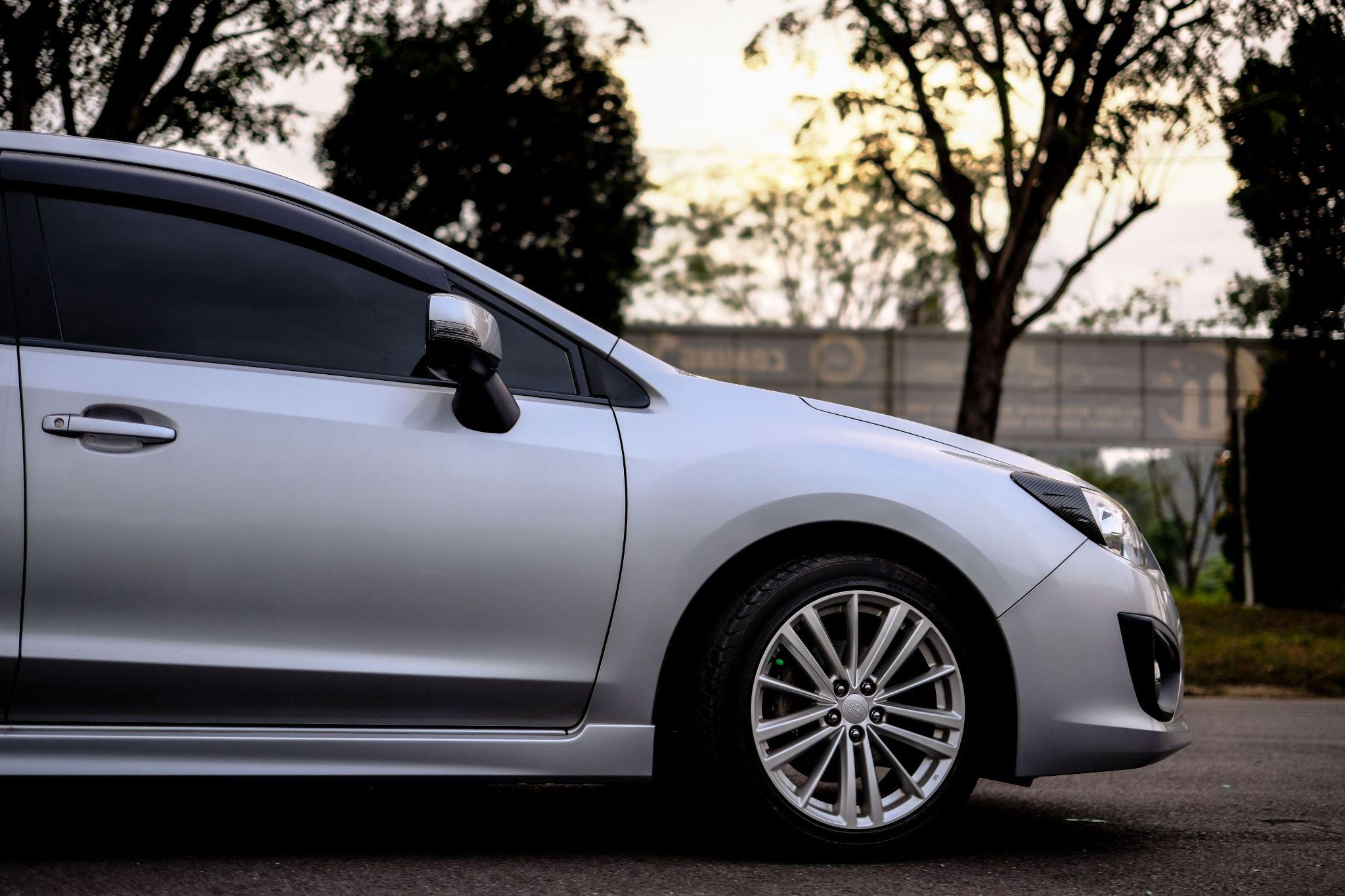 Car with professionally tinted windows for privacy and sun protection