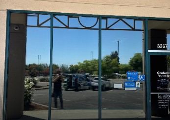 Professional commercial window tint services in California installed on large office windows.