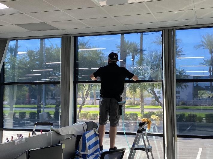 Professional solar film in California being installed on commercial glass windows.